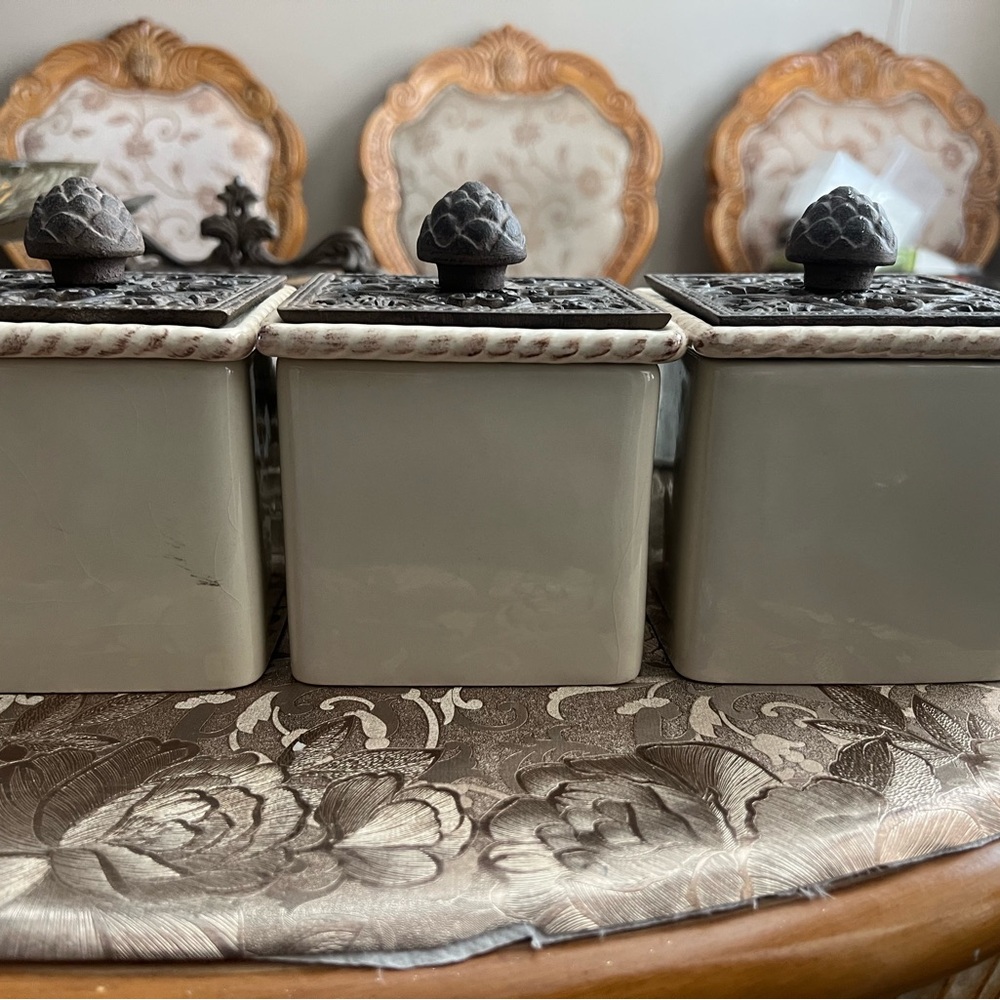 3 Small canisters with metal lids